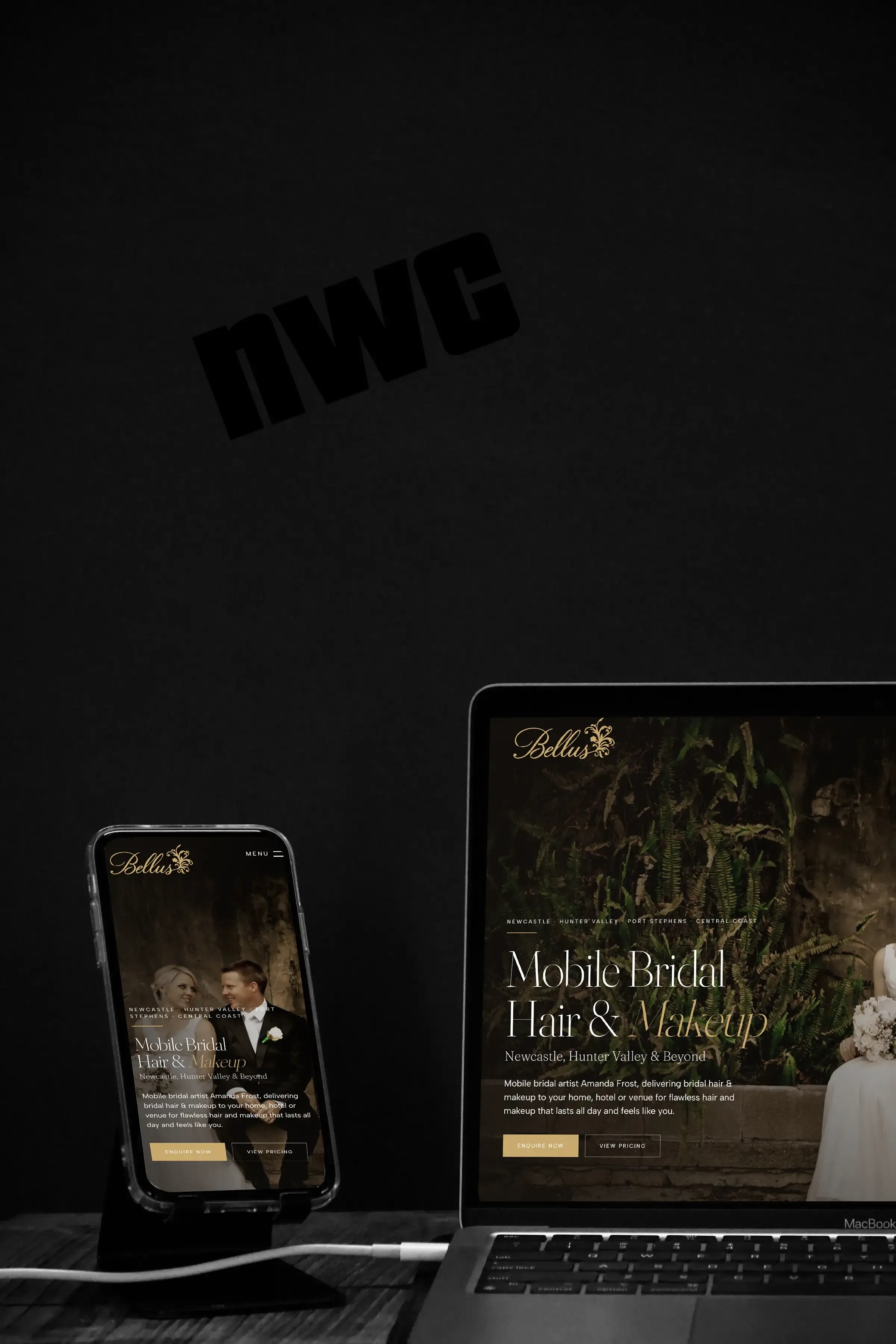 The Bellus home page on a phone in a stand beside a MacBook, against a black backdrop.